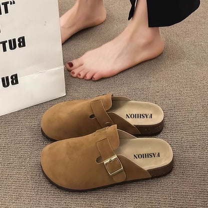 Ladies wear flip-flops with their heads covered